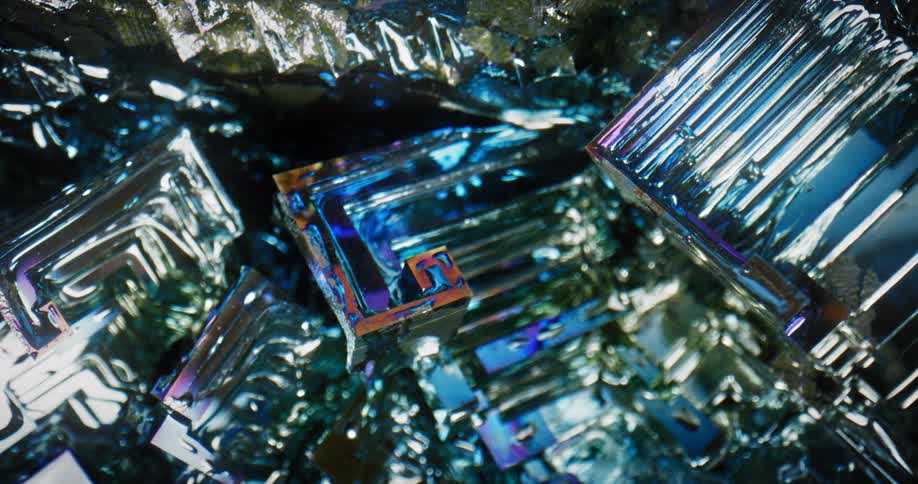 Sharp edged crystals lined with silver shine as light brightens and darkens