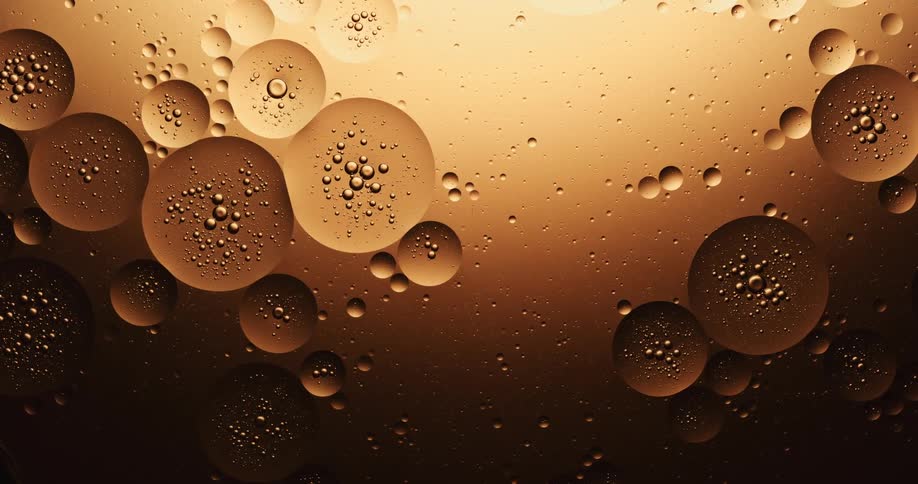 Bubbles are floating and multiplying in a thick liquid