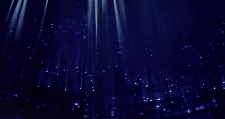 Blue white dots and streaks contrast with black background