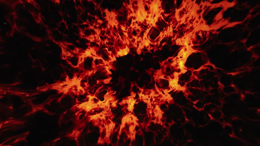 An organic orange glowing substance spreads across the darkness like flames of hot lava