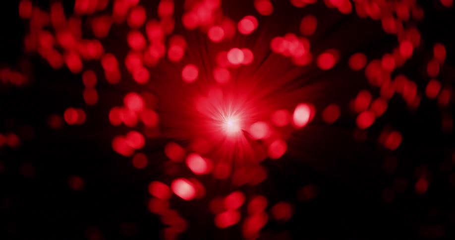 Filaments with glowing tips gyrate as they change color