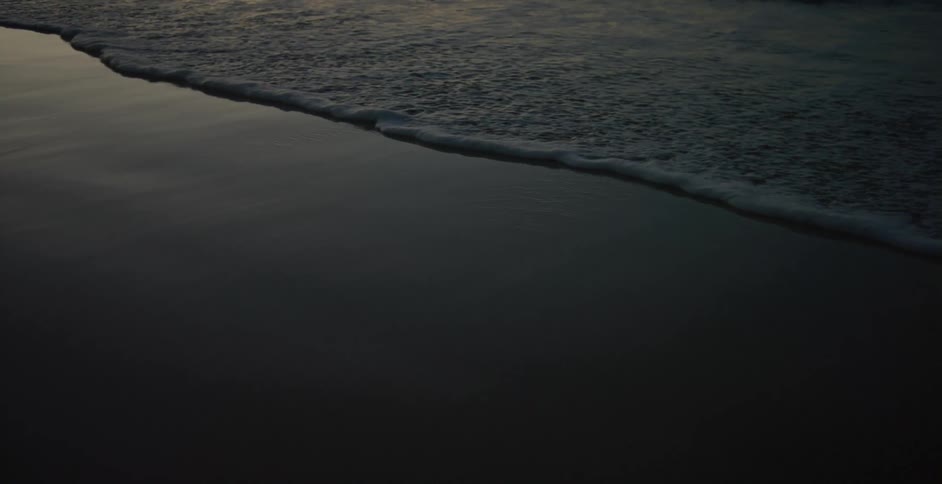 Waves roll on to a beach