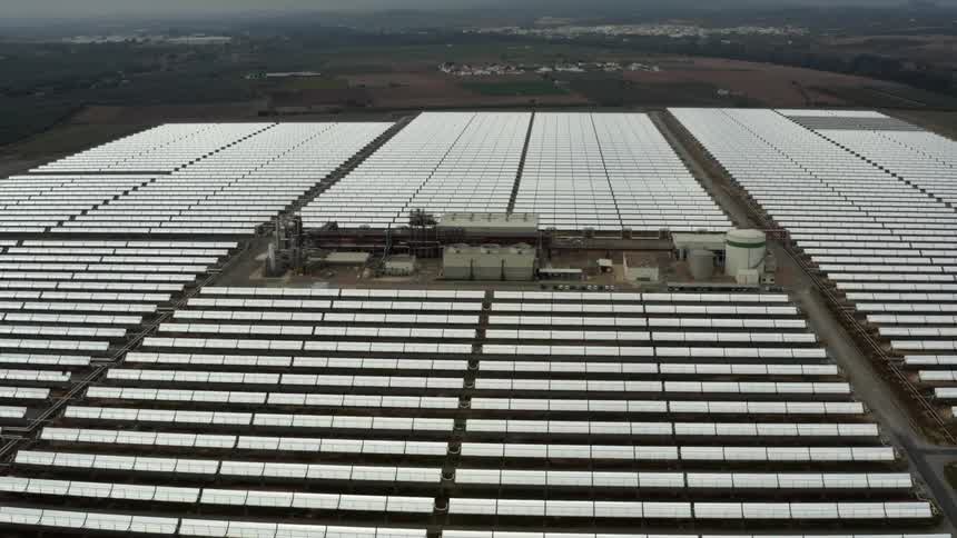 Panels surround plant facility with several tanks on site