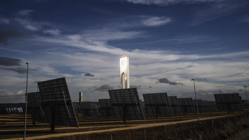 Clouds flow over the solar panels