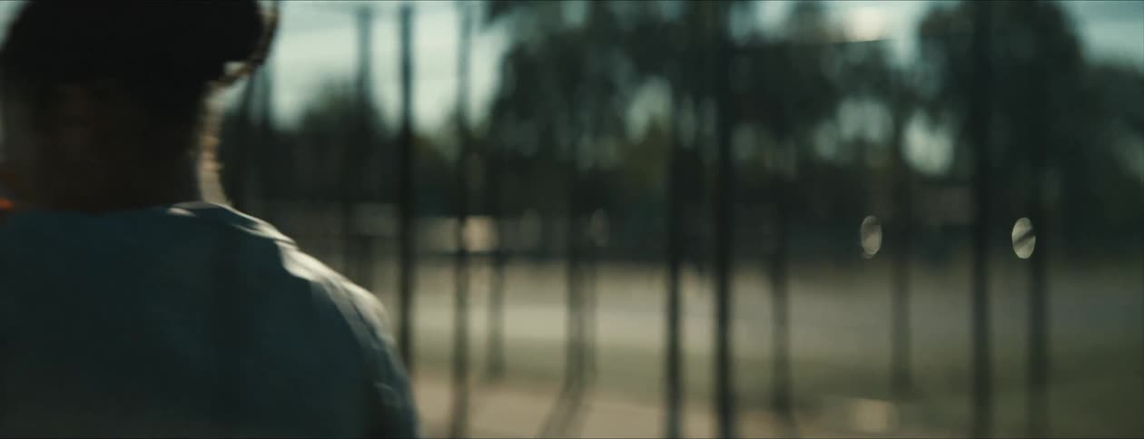 A woman playing tennis outdoors