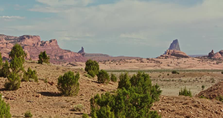 Haze hangs over a desert landscape of a mountain range