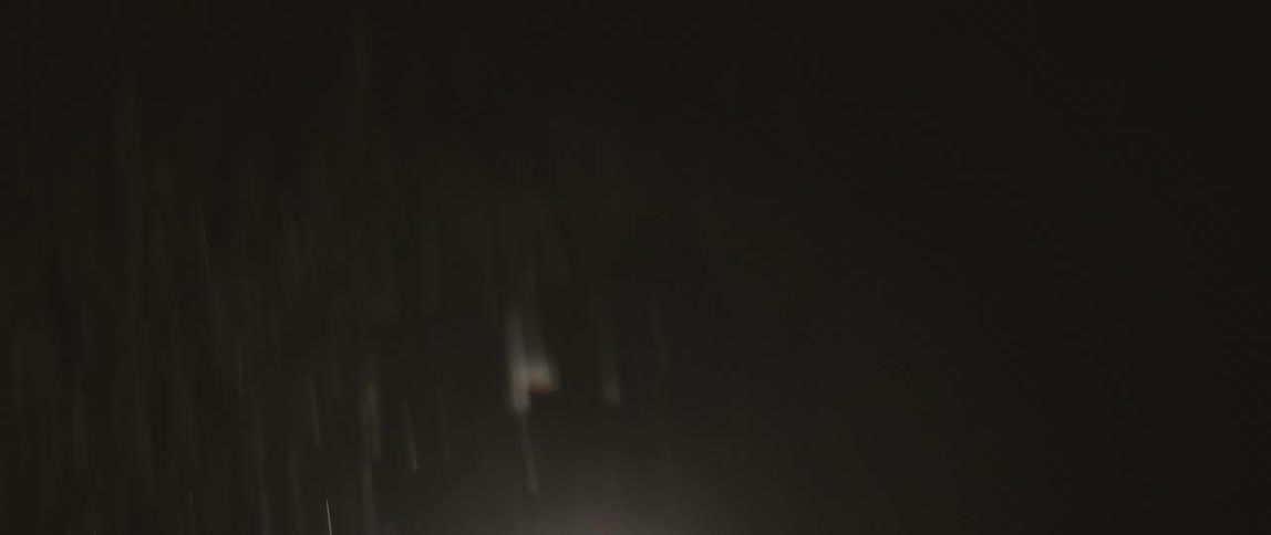 A view of rain flowing outdoors at night