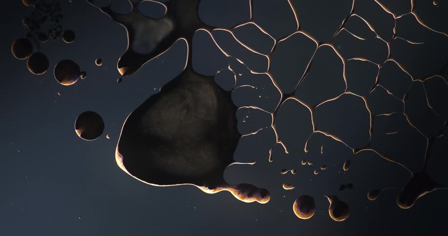 Dye in liquid moving and splitting and forming bubbles