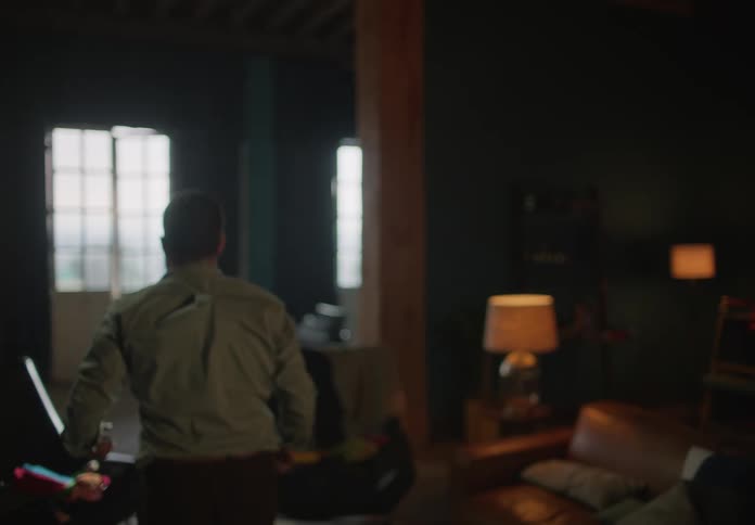 A man walks through his house