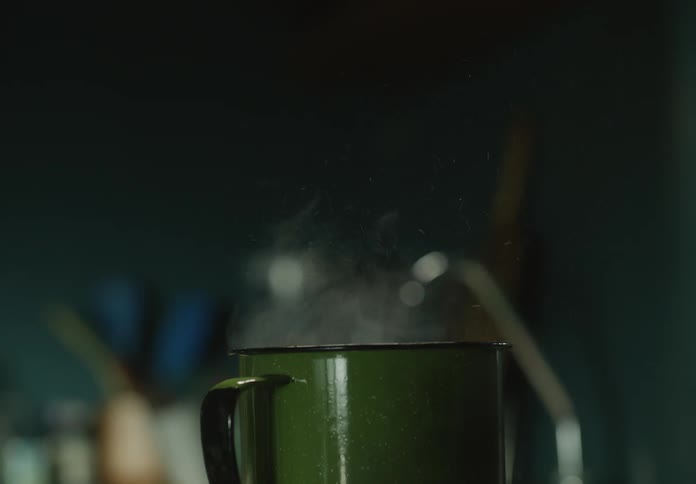 Steam is rising from a coffee mug in a kitchen