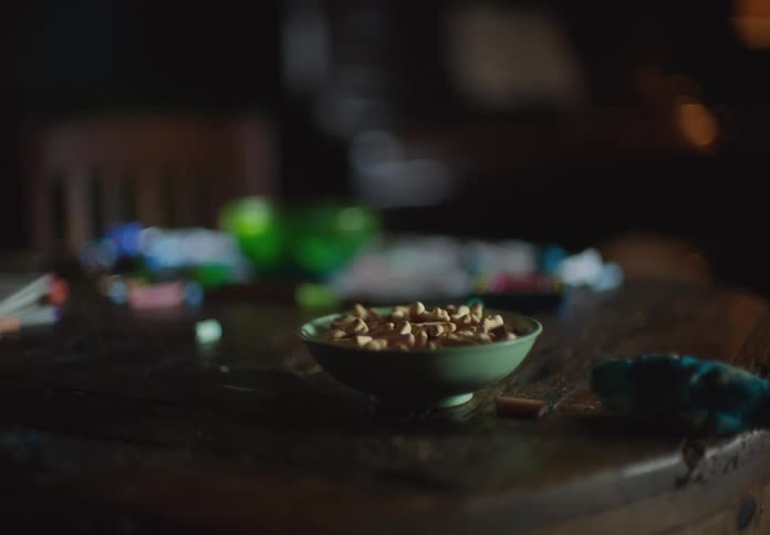 A bowl is on a table and the camera jerks away from it