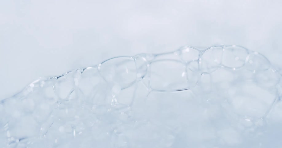 Close up of light shining over translucent bubbles