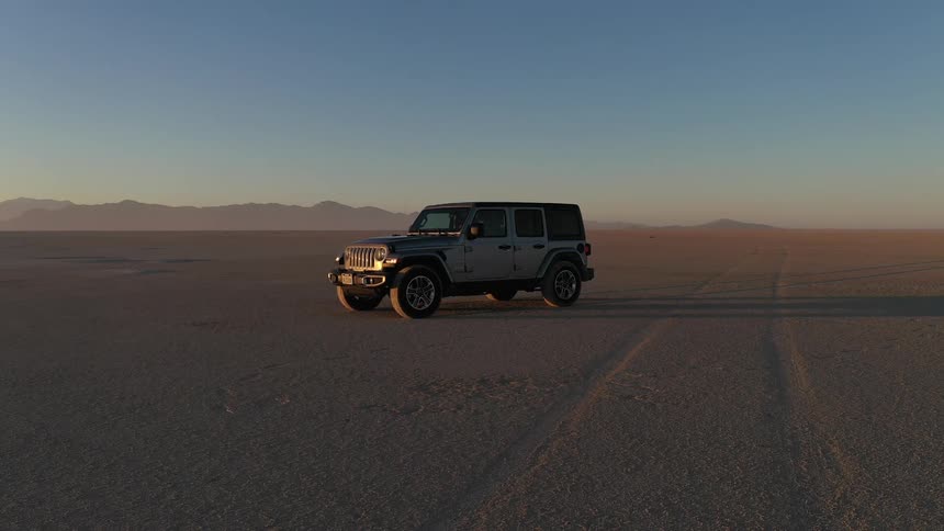 Jeep wrangler parked in middle of desert
