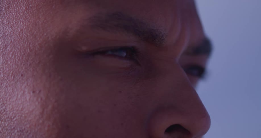 Close up of the eyes of a man against the blue sky
