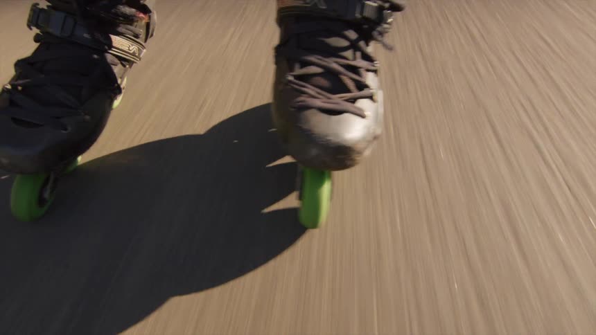 Person rollerblades along street
