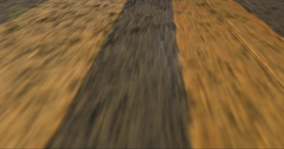 Yellow lane markings on a road during the day