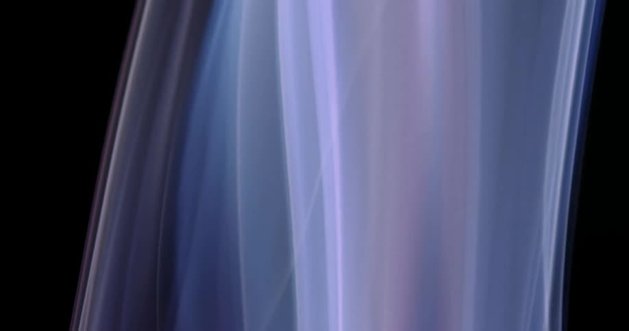 Ribbons of light in shades of blue and pink against black