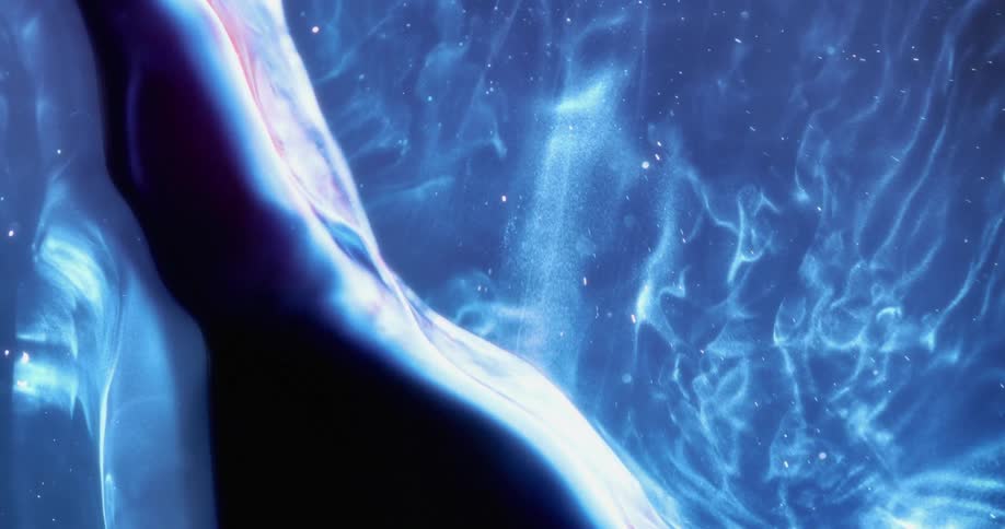 Flowing blue waves shimmering against black