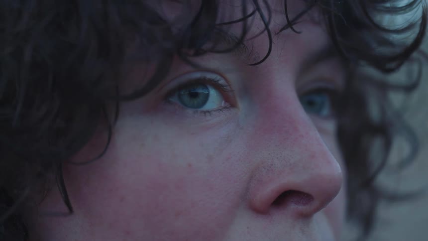 A portrait of a woman standing outdoors