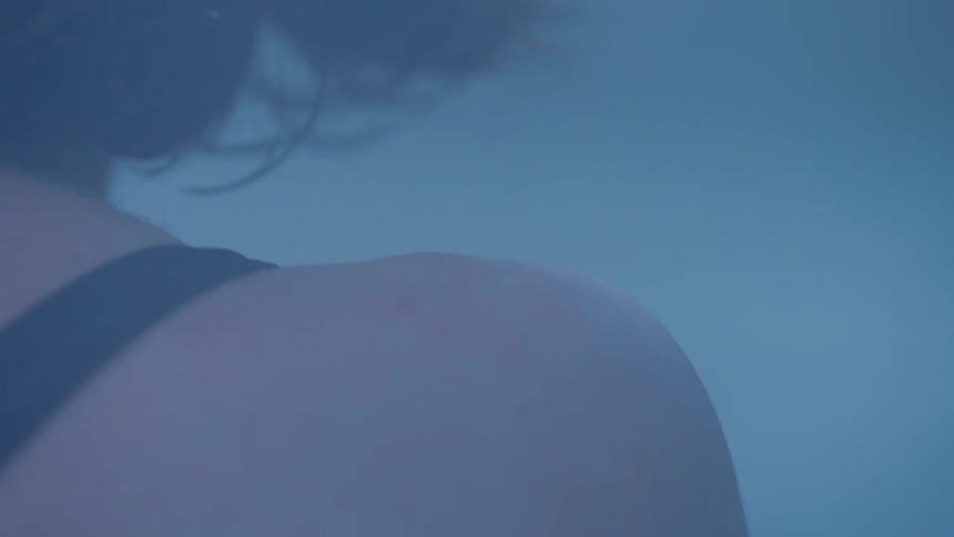 Close up of woman floating underwater