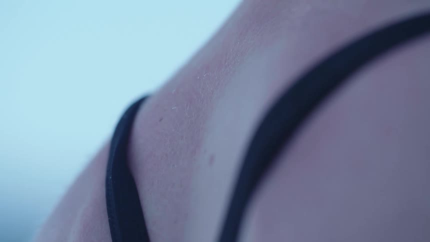 Close up of a swimsuit on a girls back