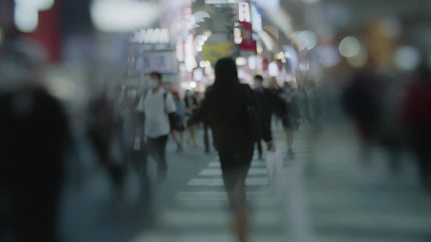 Pedestrians cross the zebra cossing