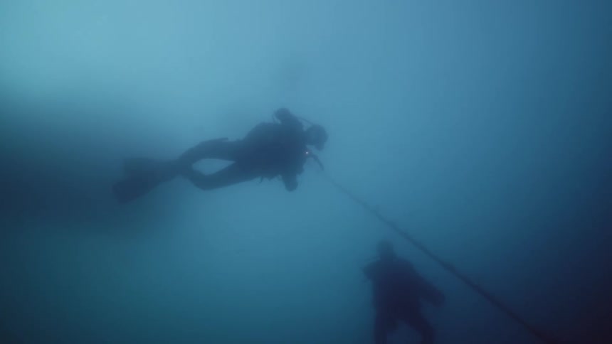 Two divers diving in the ocean