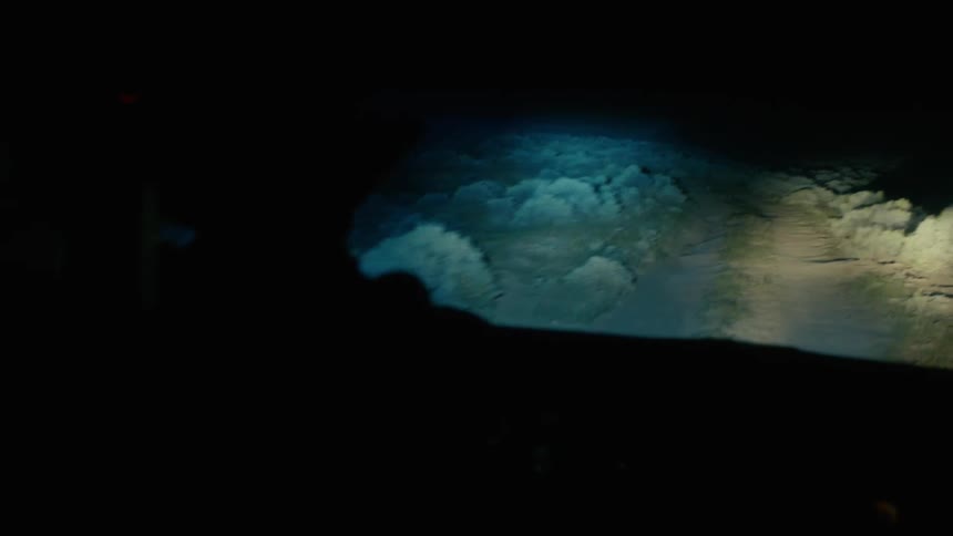 A person is driving a vehicle during the night time