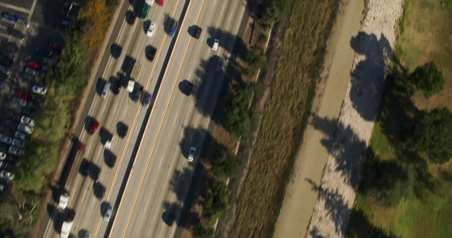 Birds eye view of cars driving on a highway during spring