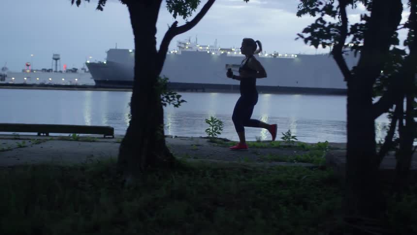 A person jogs down the sidewalk