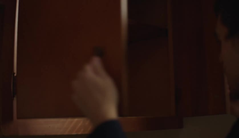 A man is upset when he sees the cupboard is empty