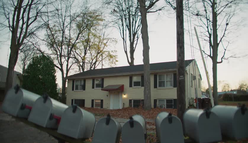 The view is of a small town and you can see a house outside