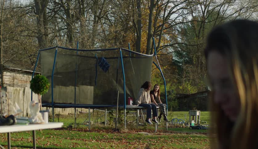 Friends are hanging outside in the forest area in the day time