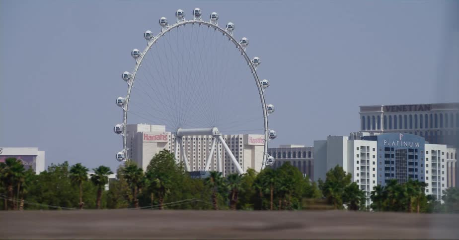 A ferris wheel is surrounded by hotels and casinos downtown