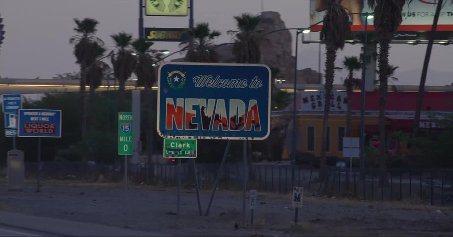 A vehicle passes a sign identifying that theyve entered a new state