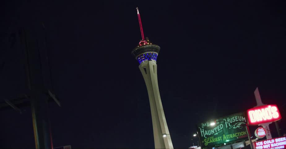 The view is at night time and you can see all the buildings in the city