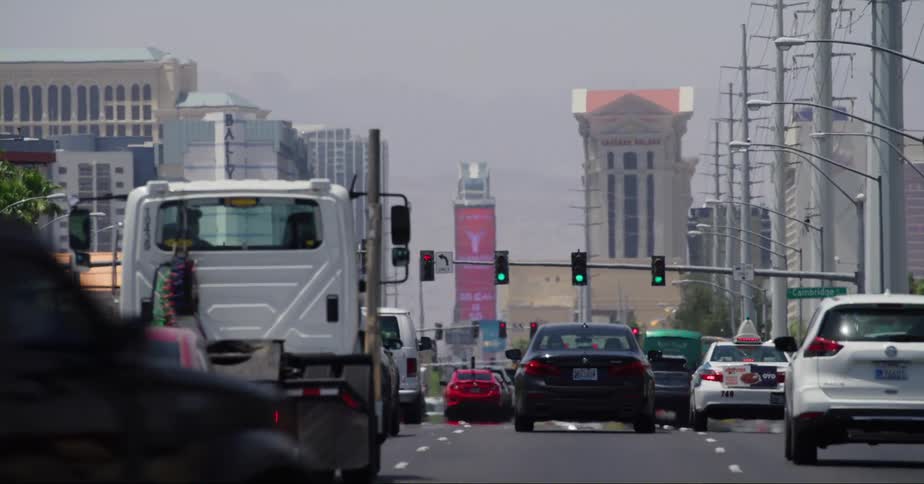 Heavy traffic passes through an intersection headed downtown