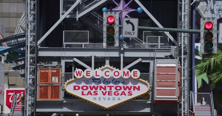 A view of a sign near some street lights