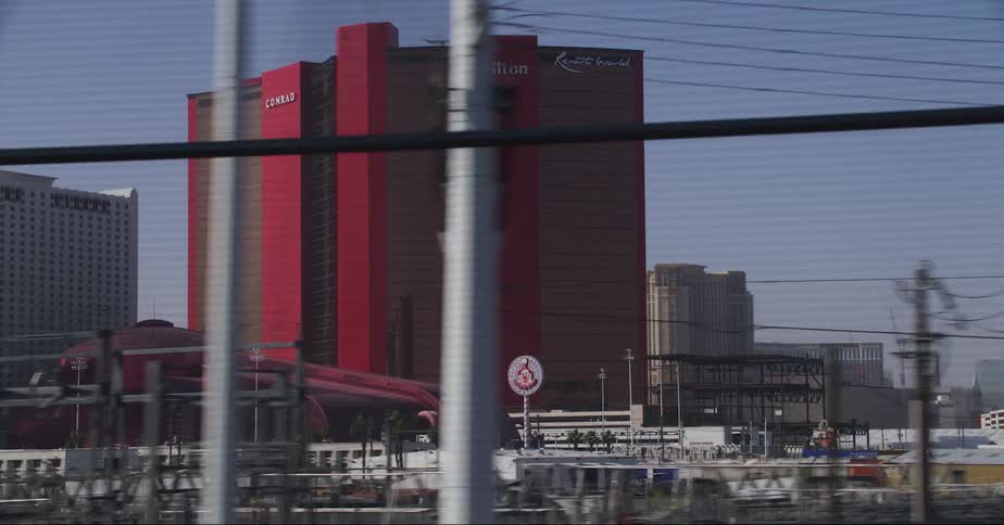 Hotels fill a city skyline along the highway
