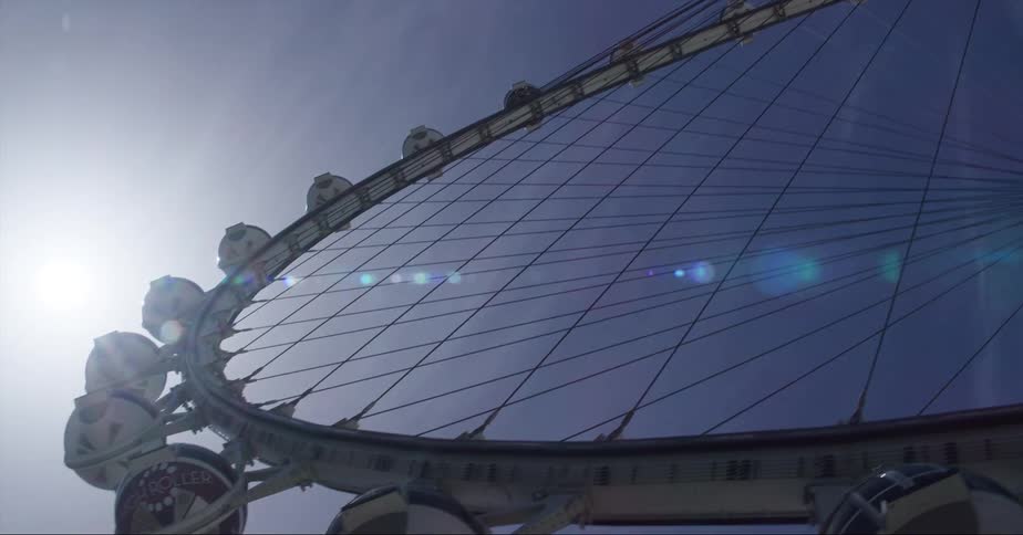 The sun shines on the ferris wheel