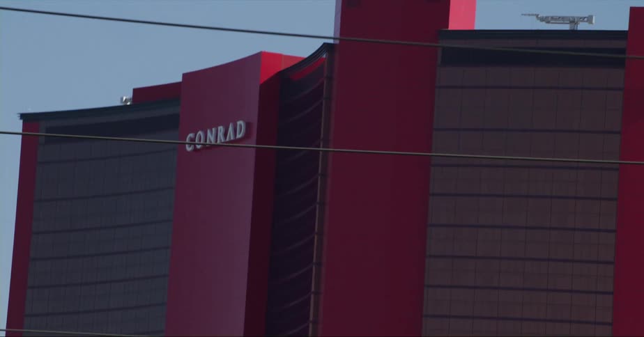 The facade of a large building in a city during the day