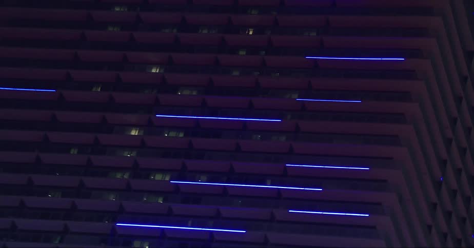 Glowing lights on a skyscraper at night