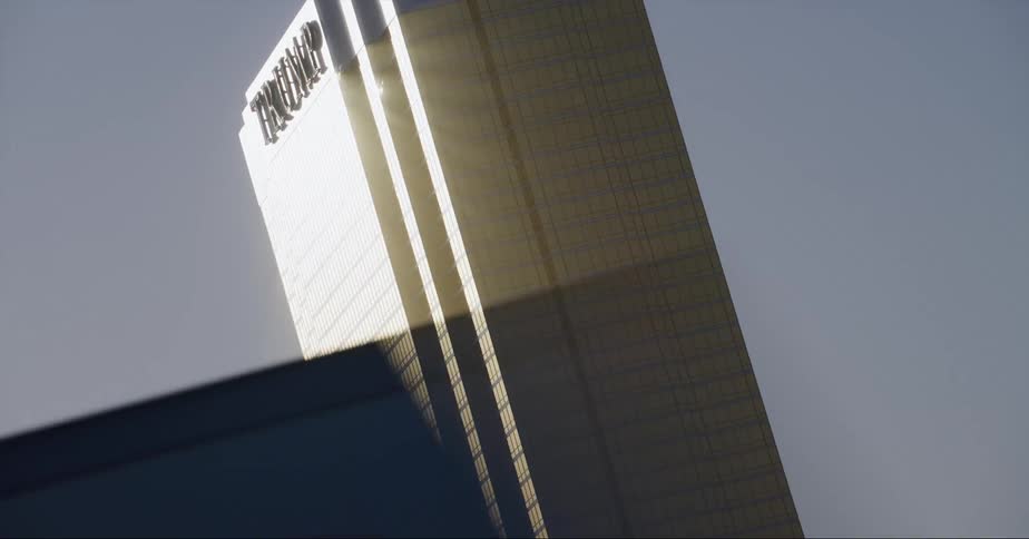 A large hotel has a trump sign at the top
