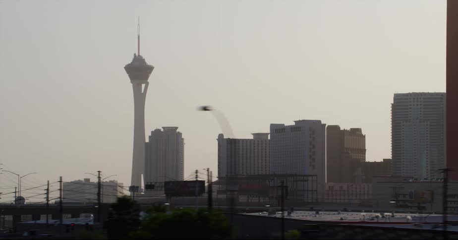 The stratosphere tower in las vegas seen from a moving vehicle at evening