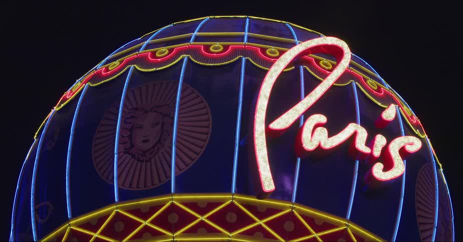 Neon lights glow brightly on paris balloon in las vegas display at night