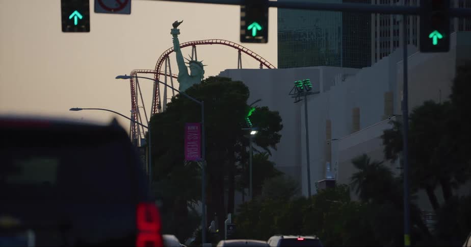 Traffic drives past the rollercoaster