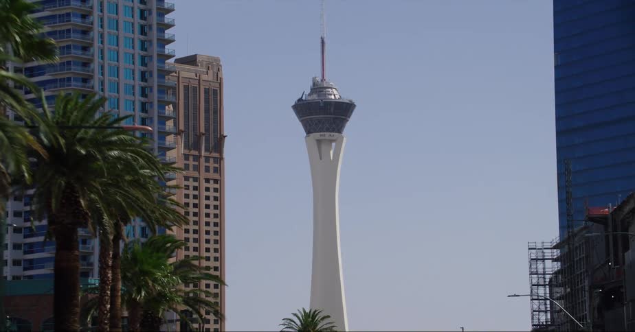 Car drives down las vegas strip passing casinos and hotels