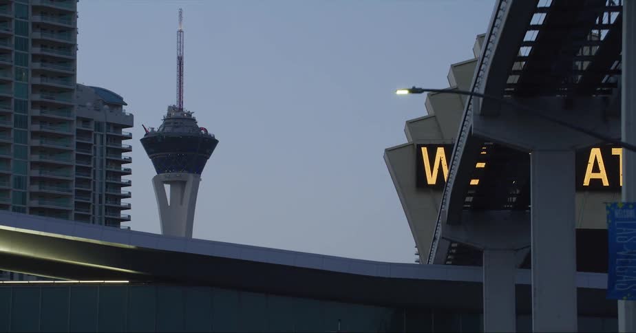 Exterior view the strat tower and buildings at dusk