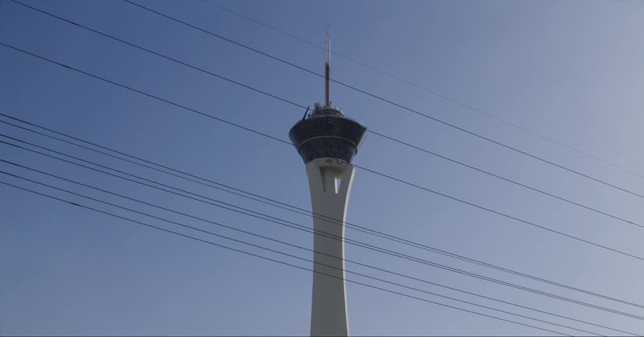 The stratosphere tower in las vegas seen from a moving vehicle at evening