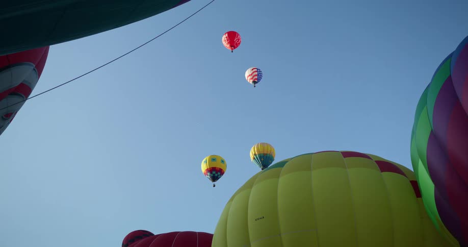 Hot air balloons float into the sky